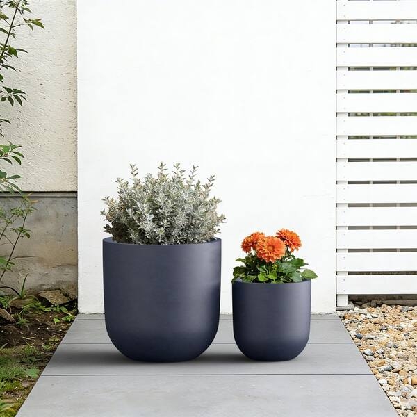Round Concrete-like Planter with Pitted Texture and Drainage for Outdoors