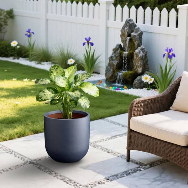 Round Planter in Matte Stone-like Material with Light Gray Interior Contrast