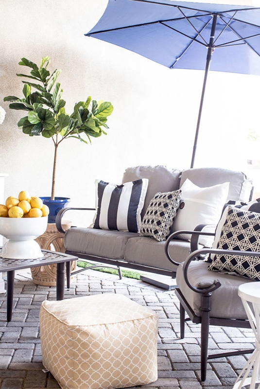 Round Stone-Look Fire Pit with Adirondack Chairs & String Lights