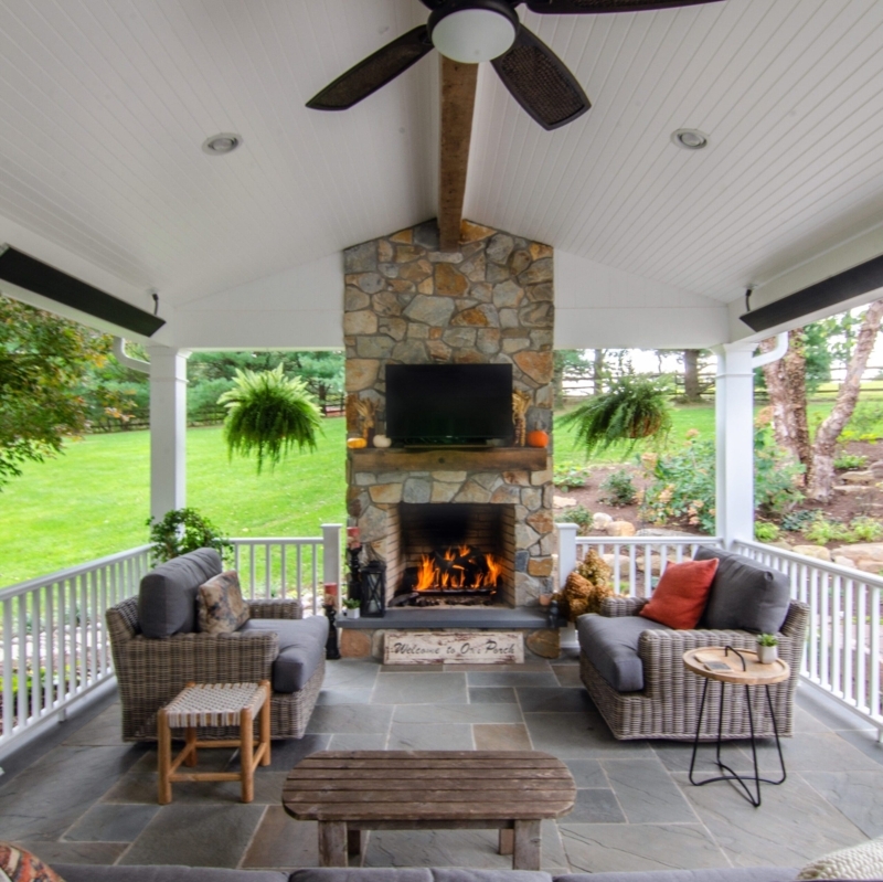 Rustic Fieldstone Outdoor Fireplace with Arched Firebox Design