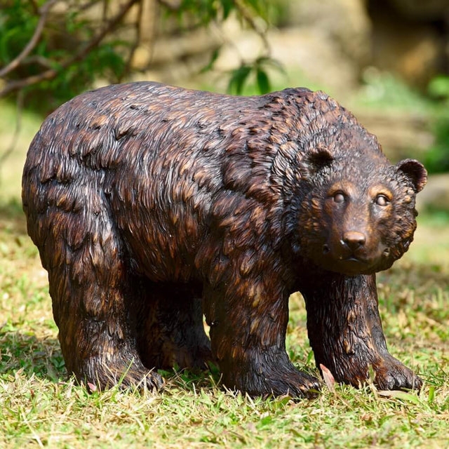 Rustic Garden Statue of a sitting bear with a wood carved aesthetic.