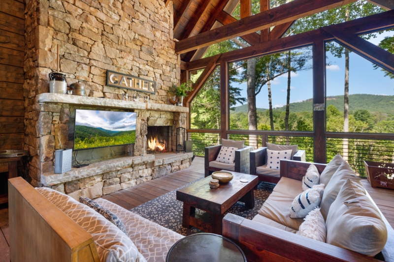 Rustic Modern Great Room with Timber Frame, Stone Fireplace and Creek View