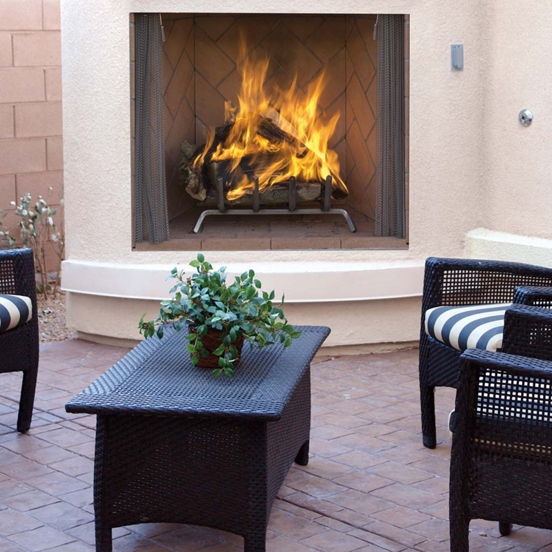Rustic Wood Burning Outdoor Fireplace with Herringbone Brick Panels