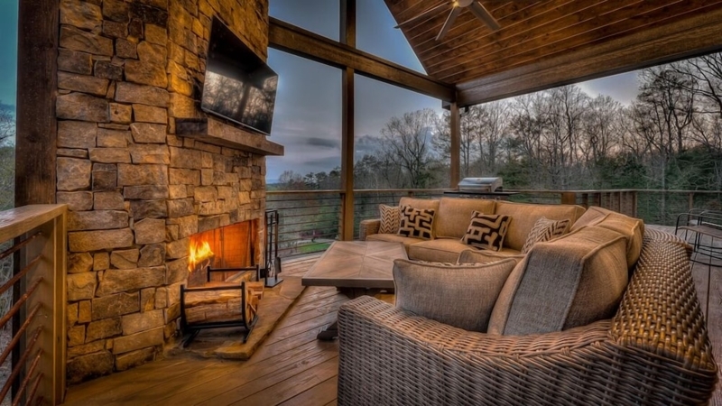 Scenic Mountain Lodge Deck with Outdoor Fireplace, Hot Tub and View