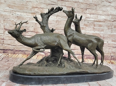 Sculpture with stag and doe composition in an antique patina finish.