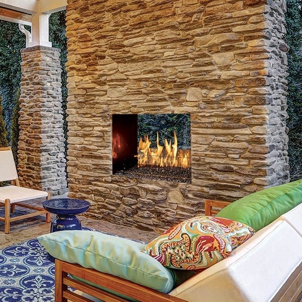 See-Through Outdoor Fireplace with Ledger Stone Surround and Fire Glass