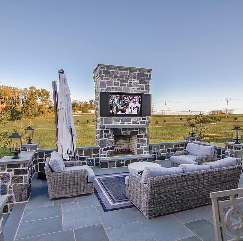 Stacked Stone Masonry Fireplace with Tiered Hearth under Pergola