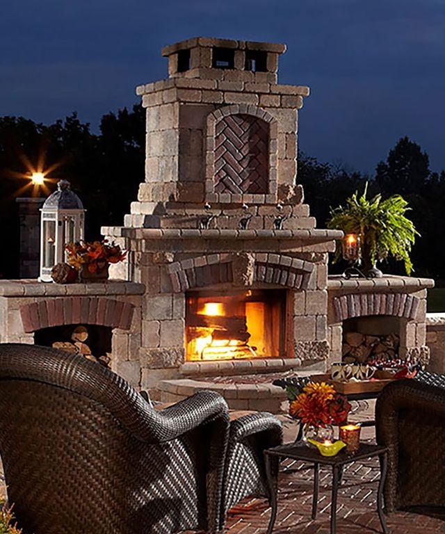 Stacked Stone Outdoor Fireplace with Wood Storage