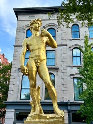 Statue of Colossal Classical Figure with Monochromatic Metallic Finish