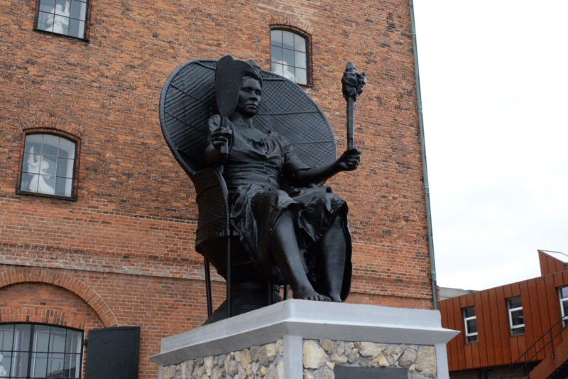 Statue: Seated Monument on Pedestal Mount in Matte Charcoal Black.