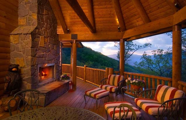 Stone-Clad Outdoor Fireplace on Covered Patio with Timber Ceiling Beams