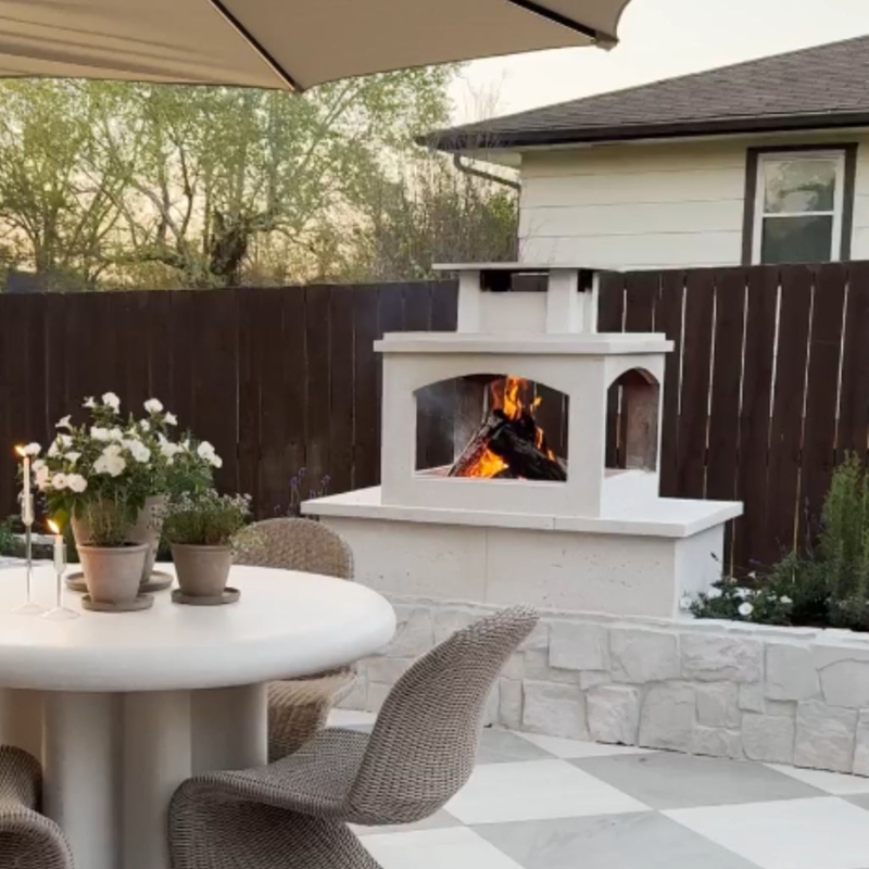 Stone Textured Fireplace with Integrated Warm Ambient Patio Lighting