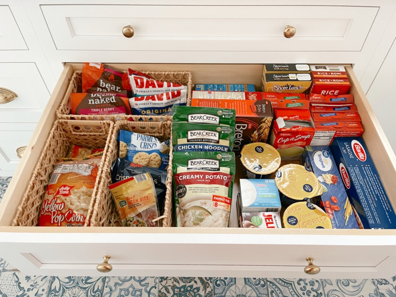 Storage Containers in Drawer with Gold Hardware and Uniform Labeling