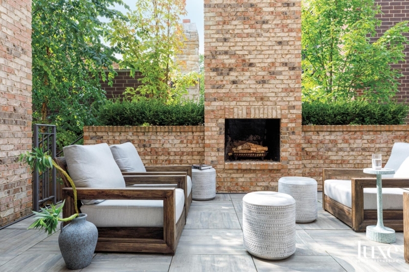 Timber Pergola Shaded Outdoor Fireplace with Stacked Stone