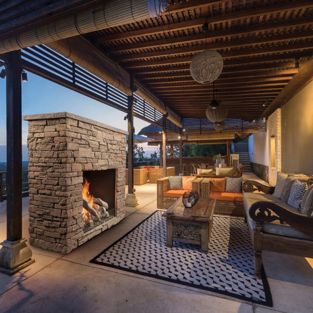 Traditional Arched Outdoor Fireplace with Stacked Stone Base