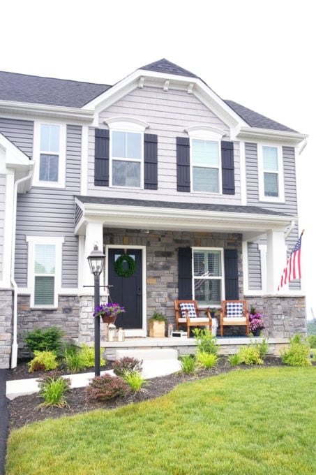 Traditional Black Slatted Rocking Chairs for Symmetrical Porch Decor