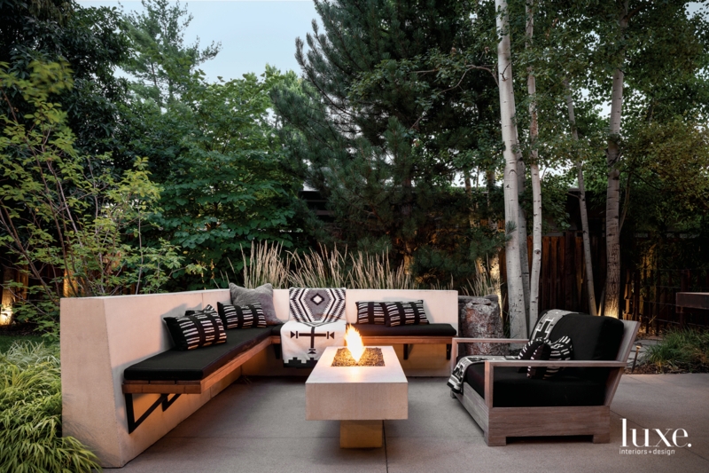 Transitional Covered Patio Outdoor Fireplace with Stone Veneer