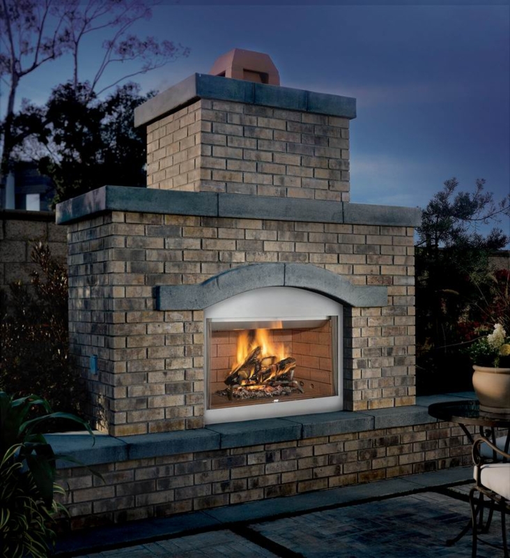 Tuscan Style Outdoor Fireplace Masonry Textured Arched Detail