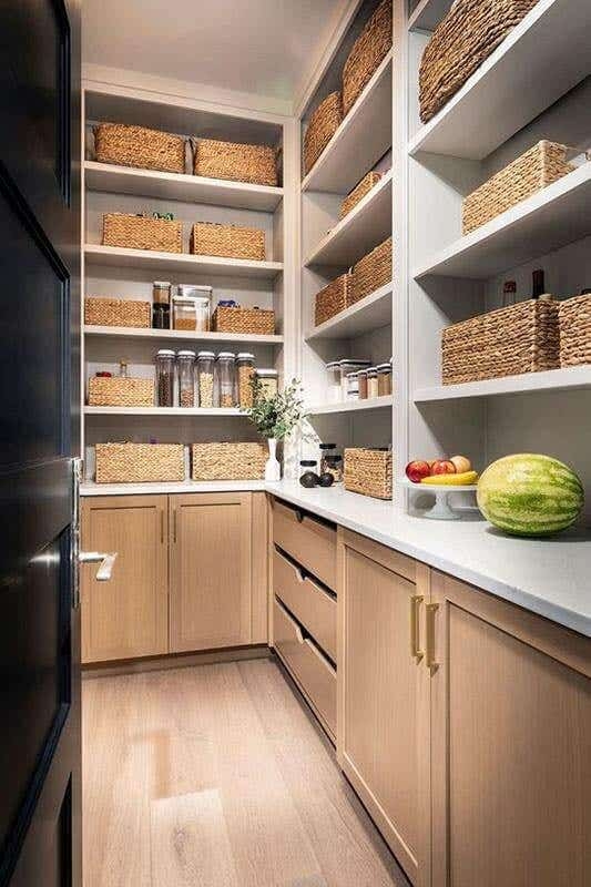 Walk-In Pantry Design with Gray Countertops and Shaker Cabinetry