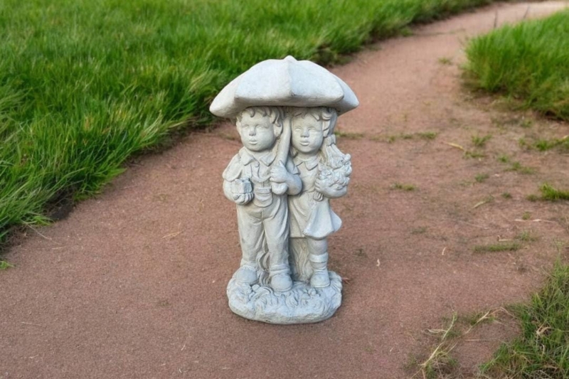 Weathered Concrete Garden Statue of Children Under Umbrella