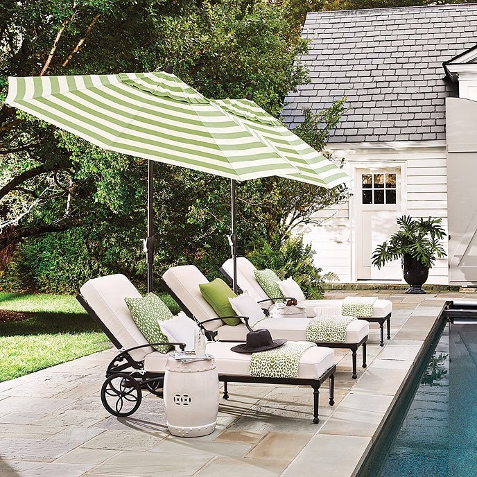 White Metal Outdoor Dining Set with Umbrella and Green Cushion Contrast