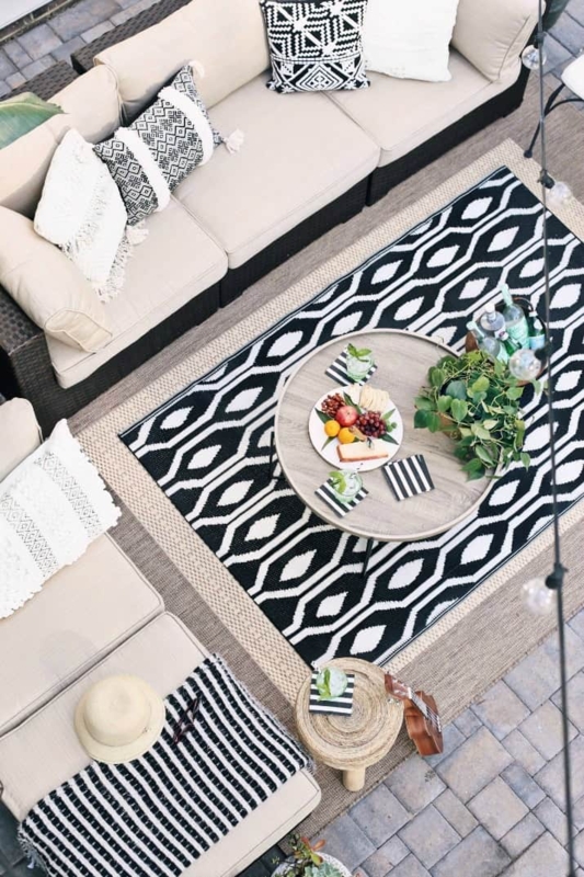 Wicker-Look Outdoor Sectional Lounge with Potted Fern Accents