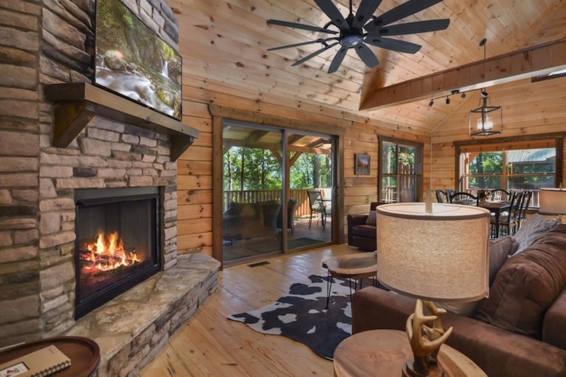 Wood-Paneled Game Room with Pool Table and Vaulted Ceiling