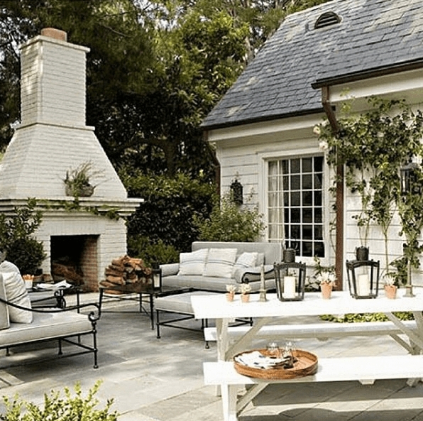 Wood Toned Patio Table with Woven Chairs and Lattice Outdoor Rug