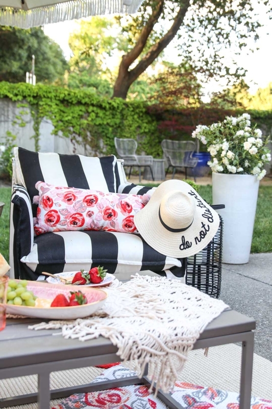 Woven Armchairs in Cozy Patio Seating Arrangement with Navy Rug