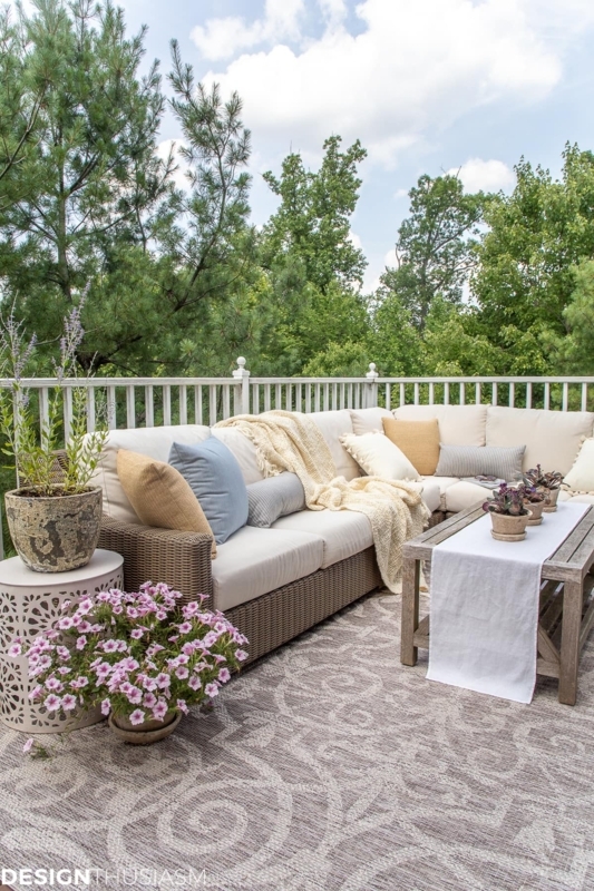 Woven Patio Furniture with Umbrella and Navy Coastal Accents