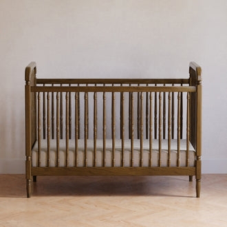 Airy Scandinavian Nursery Crib featuring Slender Spindles