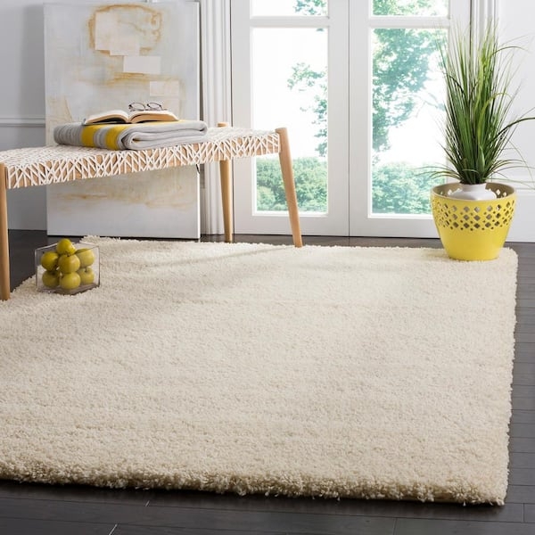 Area Rug: Ivory Shag High Pile Styled with Blue Wall Paneling