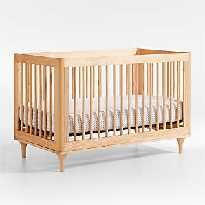 Baby Crib featuring Black Spindles and Natural Frame Contrast