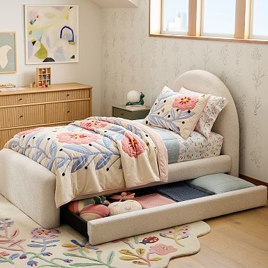 Cream Upholstered Bed featuring Arched Headboard and Trundle Unit
