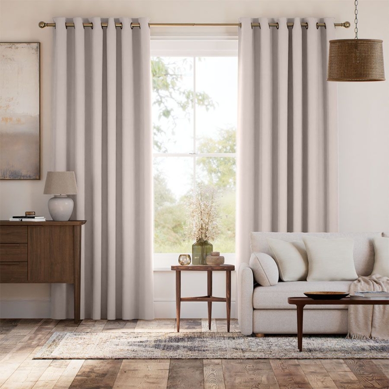 Curtain Panel with Rust Grommet Header and Tailored Pleat Window Styling