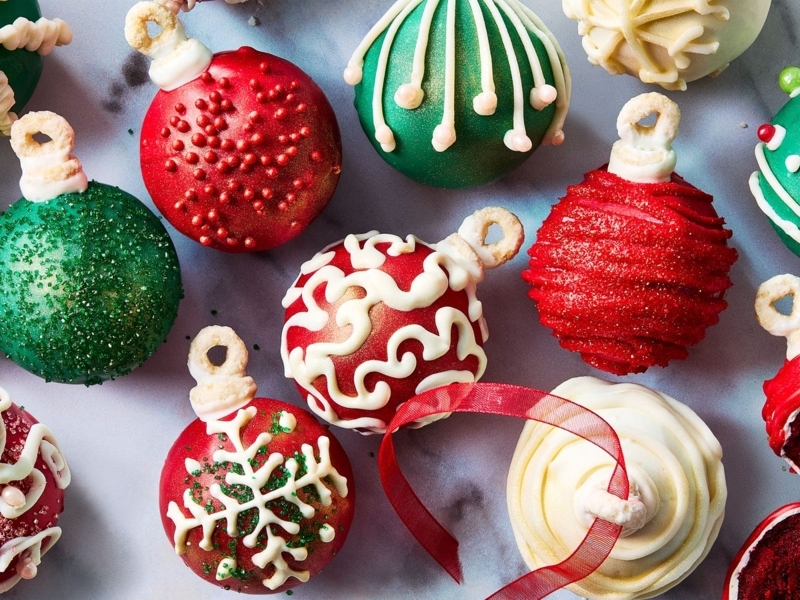 Festive Cake Balls Styled as Christmas Ornaments with Icing Drizzle
