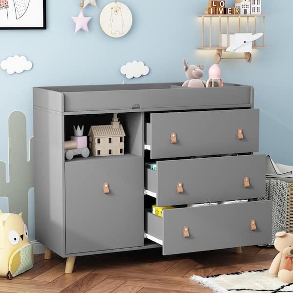 Gray Nursery Storage with Open Shelf and Asymmetrical Drawers