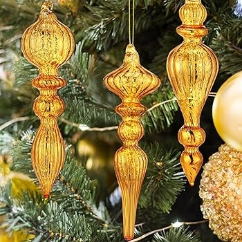 Mercury Glass Finial Ornaments Arranged on Rustic Wood Surface