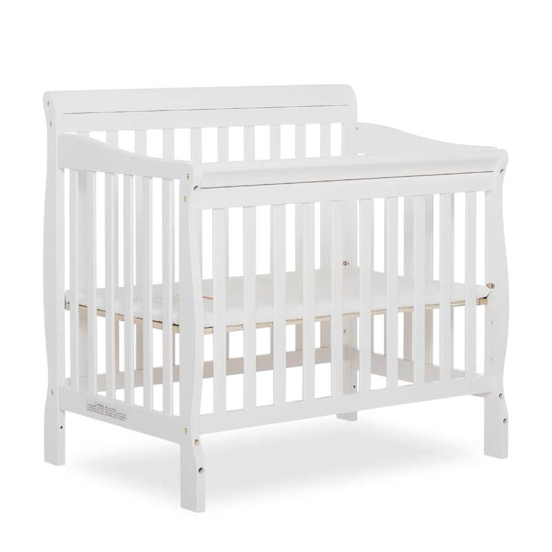White Mini Crib Nursery Design for Small Spaces with Solid End Panels
