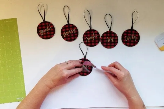 Wooden Christmas Ornaments: Round Shape with Festive White Script Lettering.