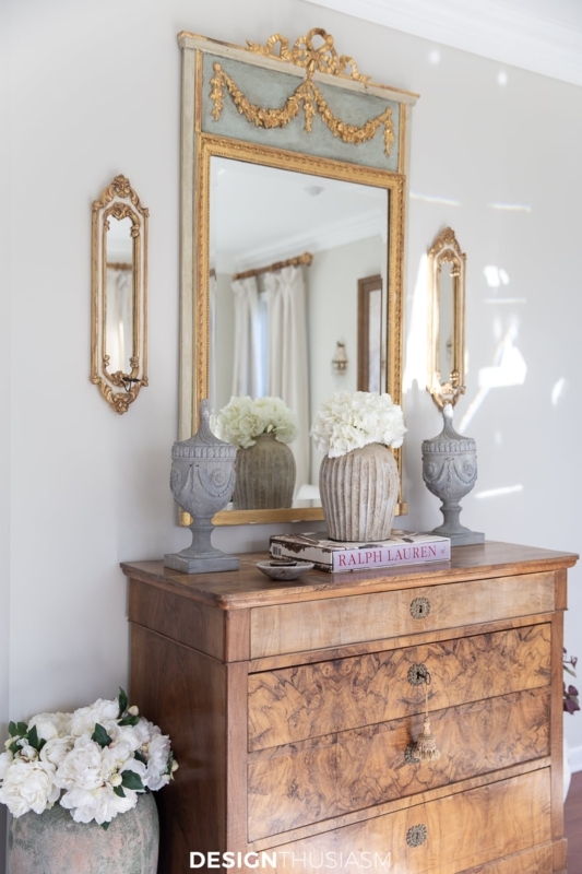 Accent Mirror: Large Arched Gilded Frame against Wainscoting