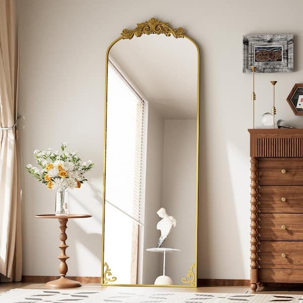 Arched Floor Mirror with Ornate Carved Crest and Polished Metal Frame