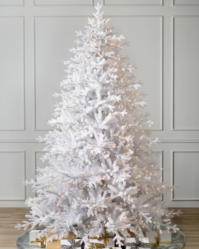 Artificial Tree Pre-Lit by Stone-Like Fireplace and Wood Mantel