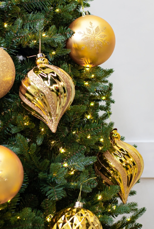 Christmas Ornament: Oversized spherical balls with dense gold glitter finish.