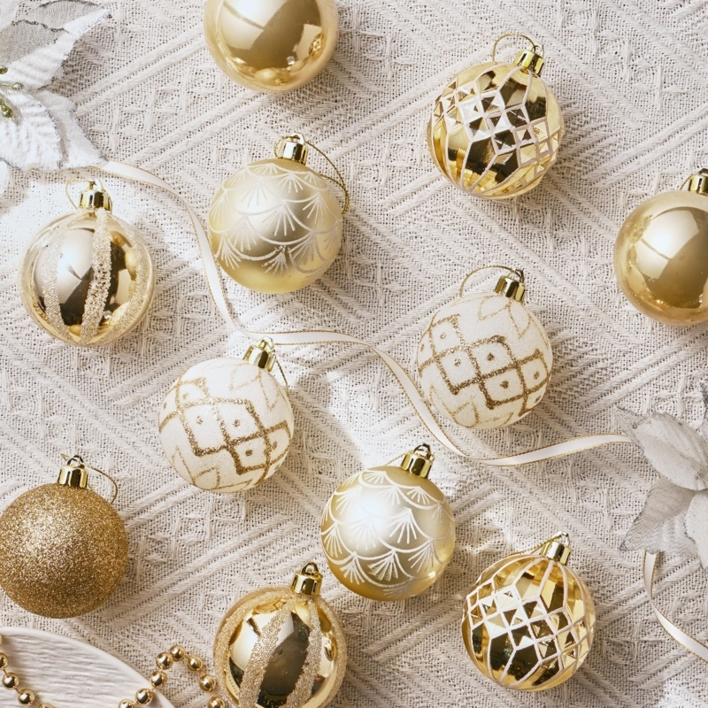 Christmas Ornaments: White and gold theme, shatterproof, mixed textures.