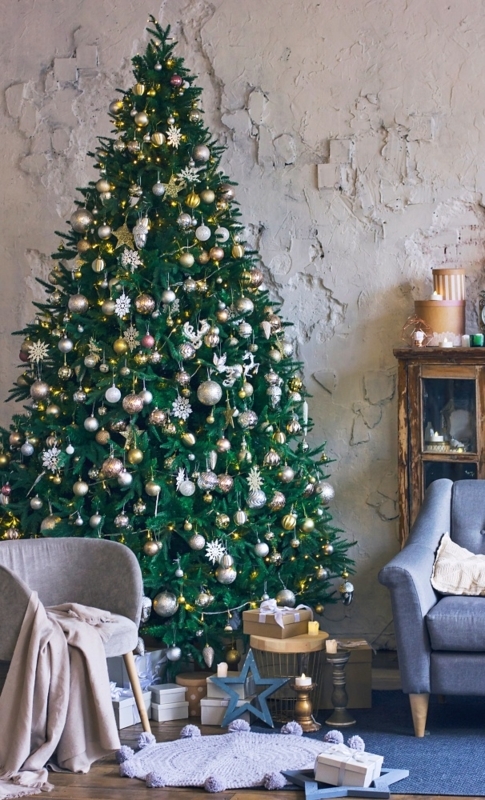Christmas Tree in Traditional Wood Paneled Room with Fireplace Mantel