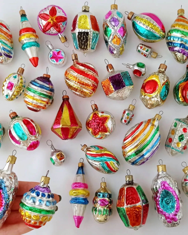 Colorful Mercury Glass Ornaments Arranged in Rainbow Gradient