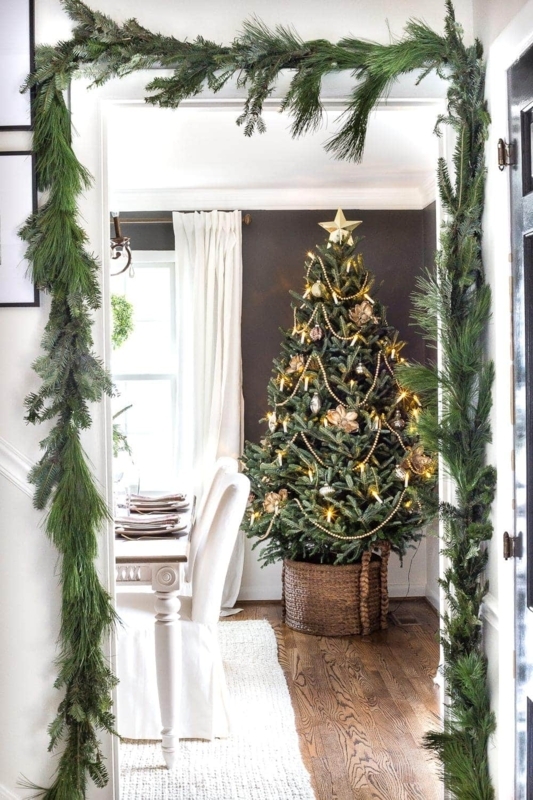Decorated Real Christmas Tree with Elegant Wide White Ribbon Garland