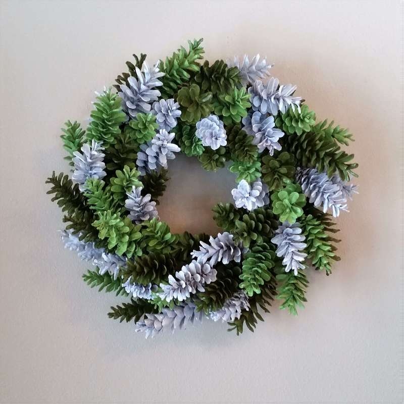 Dense Pinecone Wreath Organic Holiday Decoration on Dark Wood Door