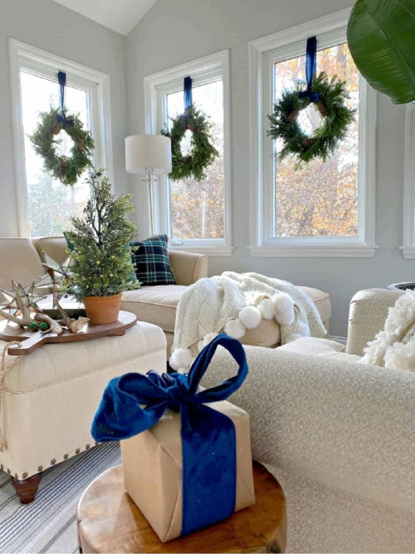Evergreen Wreath on Interior Window with Striped Ribbon Display